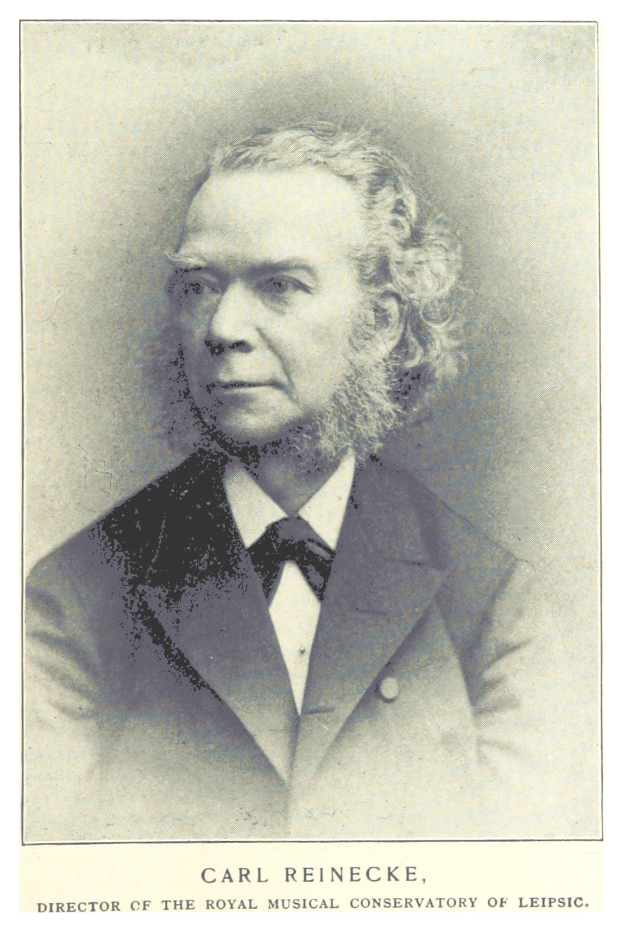 Schwarzes und weißes Foto von Carl Reinecke, Direktor der Königlichen Musikhochschule Leipzig, der einen Anzug trägt, mit Text unten.